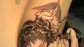 Tattooing Dragon Head on Tit !!!
