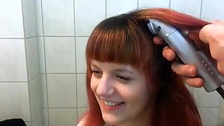 Sexy redhead shaves her head bald