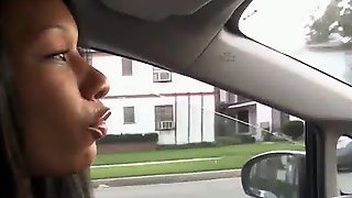 Busty black gf blows cock in car